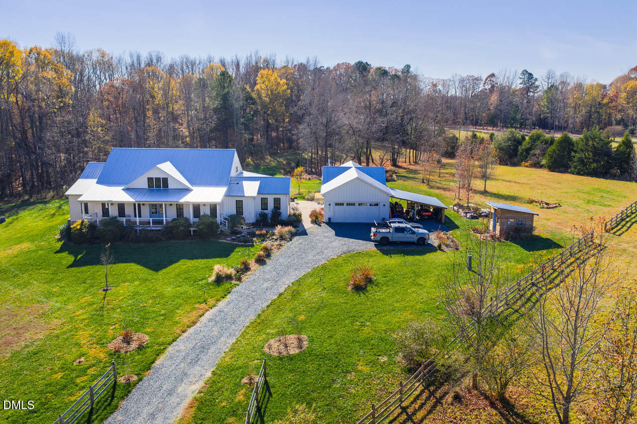 3833 Blakely Way Efland, NC 27243 - Photo 2 of 69 a view of a house with a big yard