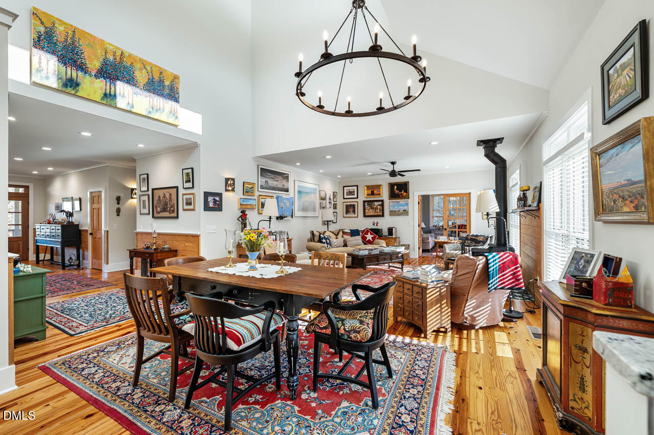 3833 Blakely Way Efland, NC 27243 - Photo 21 of 69 a view of a dining room with furniture window and wooden floor
