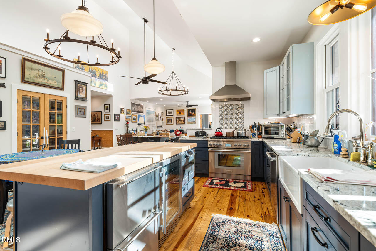 3833 Blakely Way Efland, NC 27243 - Photo 28 of 69 a kitchen with stainless steel appliances granite countertop a stove and cabinets