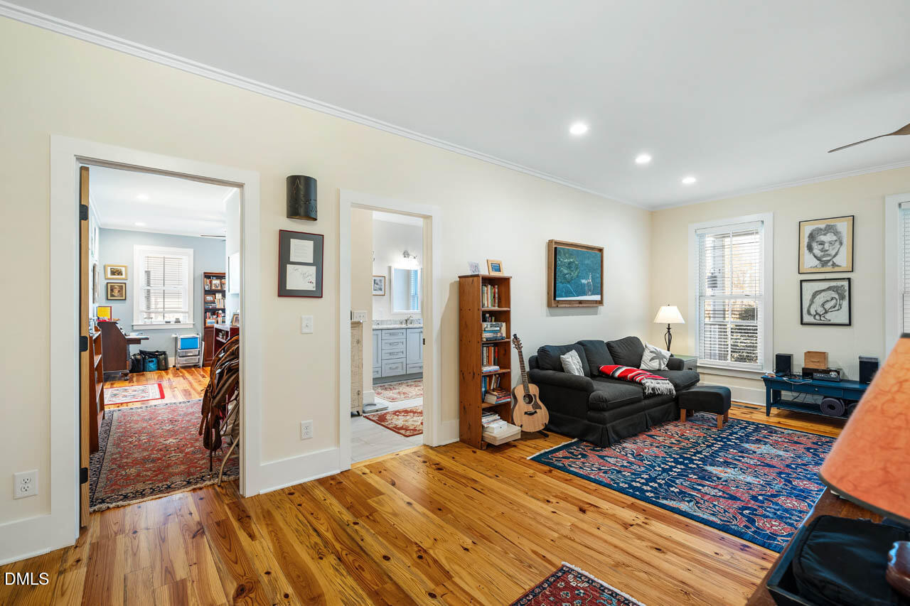 3833 Blakely Way Efland, NC 27243 - Photo 32 of 69 a living room with furniture and a wooden floor