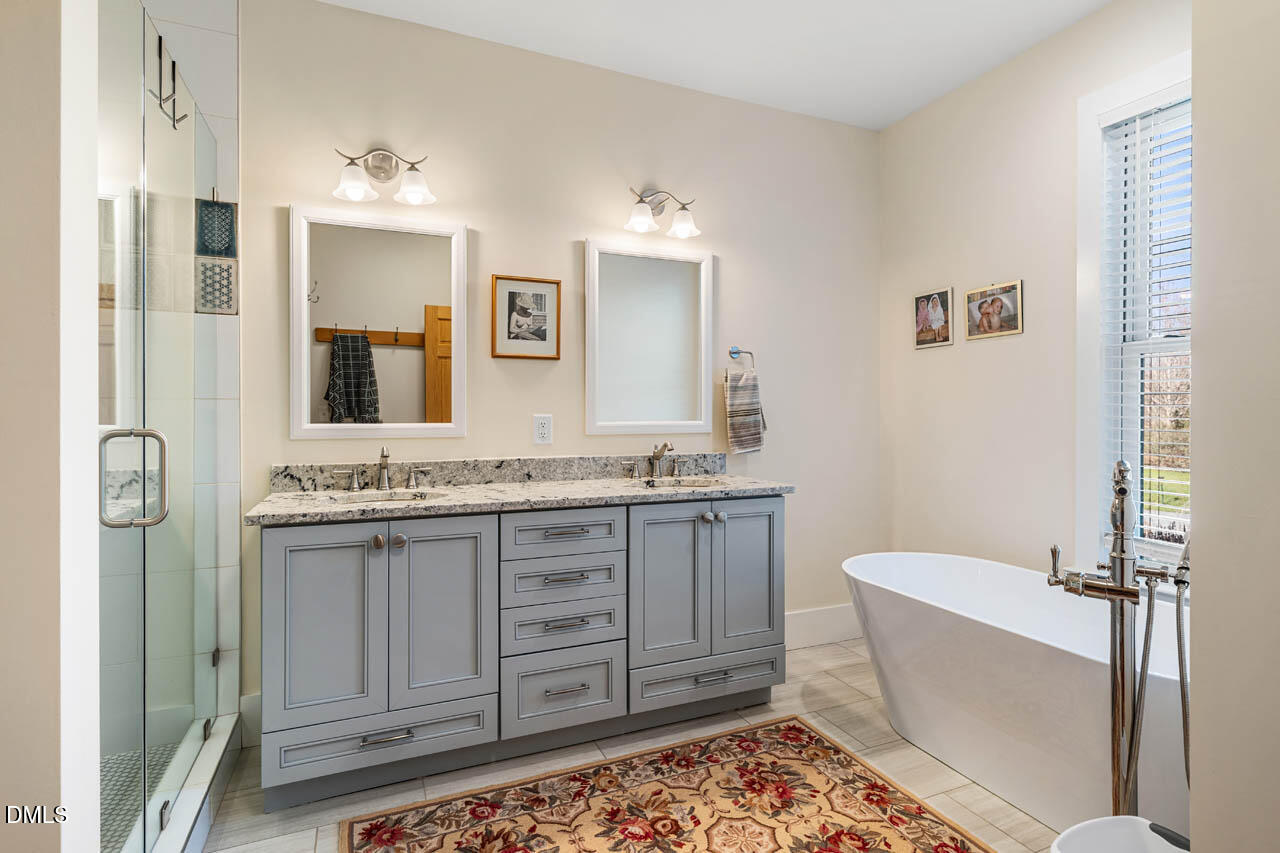 3833 Blakely Way Efland, NC 27243 - Photo 33 of 69 a bathroom with a granite countertop sink toilet and shower