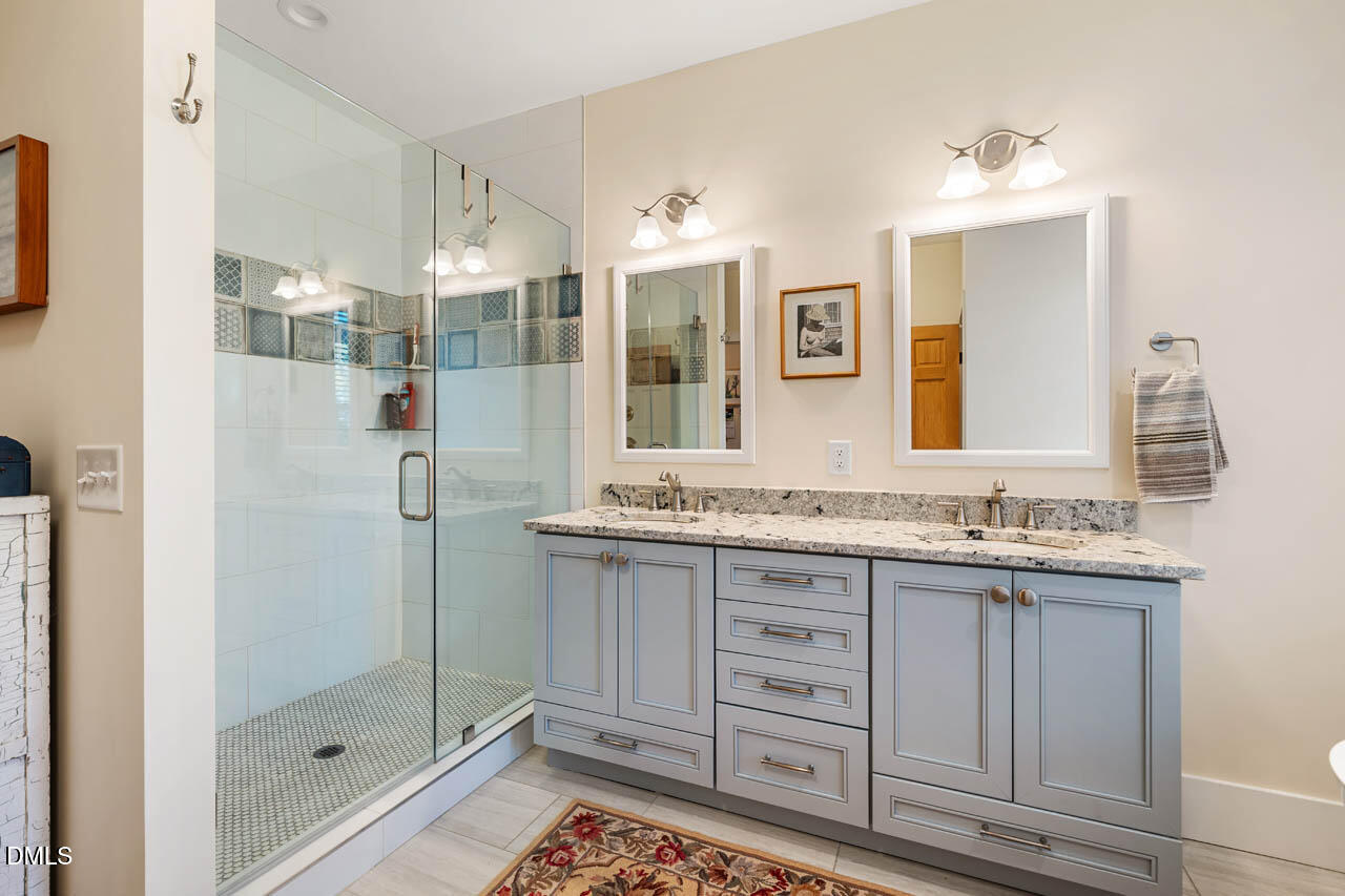 3833 Blakely Way Efland, NC 27243 - Photo 35 of 69 a bathroom with a granite countertop sink mirror and double