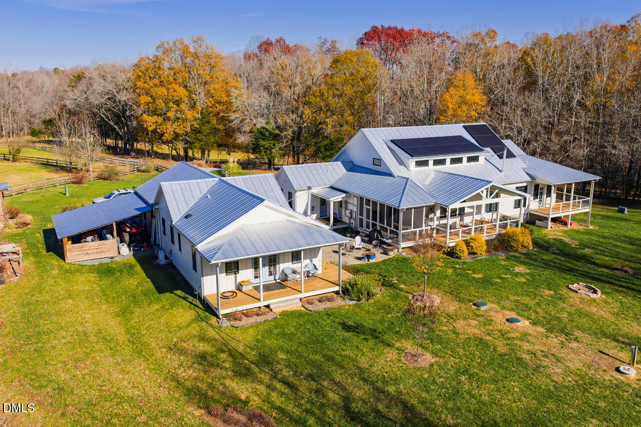 3833 Blakely Way Efland, NC 27243 - Photo 4 of 69 an aerial view of a house with swimming pool and big yard