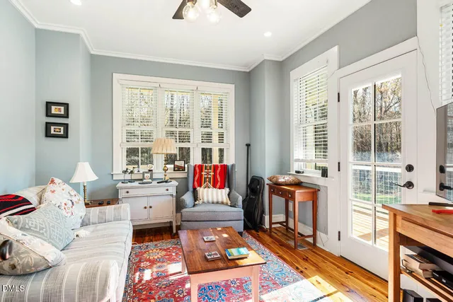 a view of a patio with chairs and potted plants
