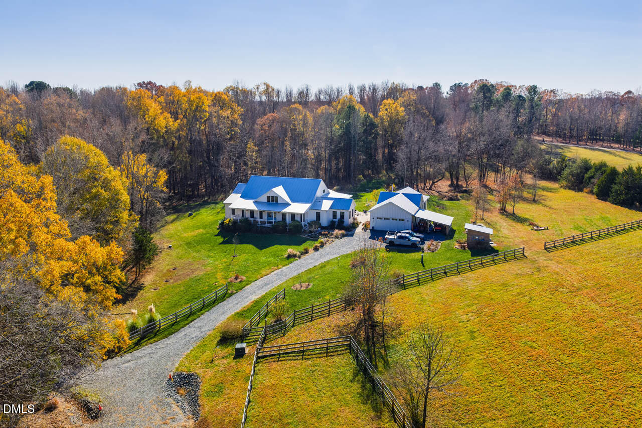 3833 Blakely Way Efland, NC 27243 - Photo 67 of 69 a view of a swimming pool with a bench and trees in the background