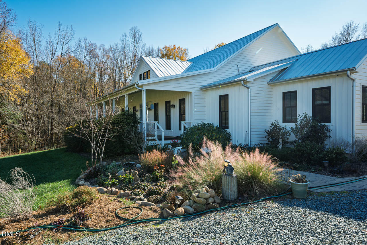3833 Blakely Way Efland, NC 27243 - Photo 8 of 69 a front view of a house with a yard