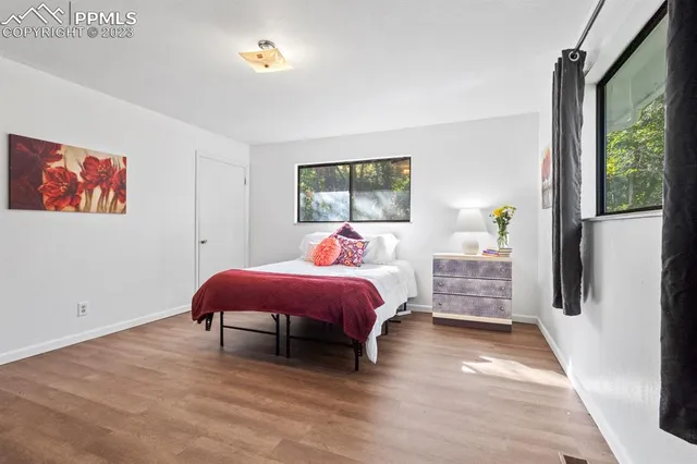 a bed room with a bed and a window