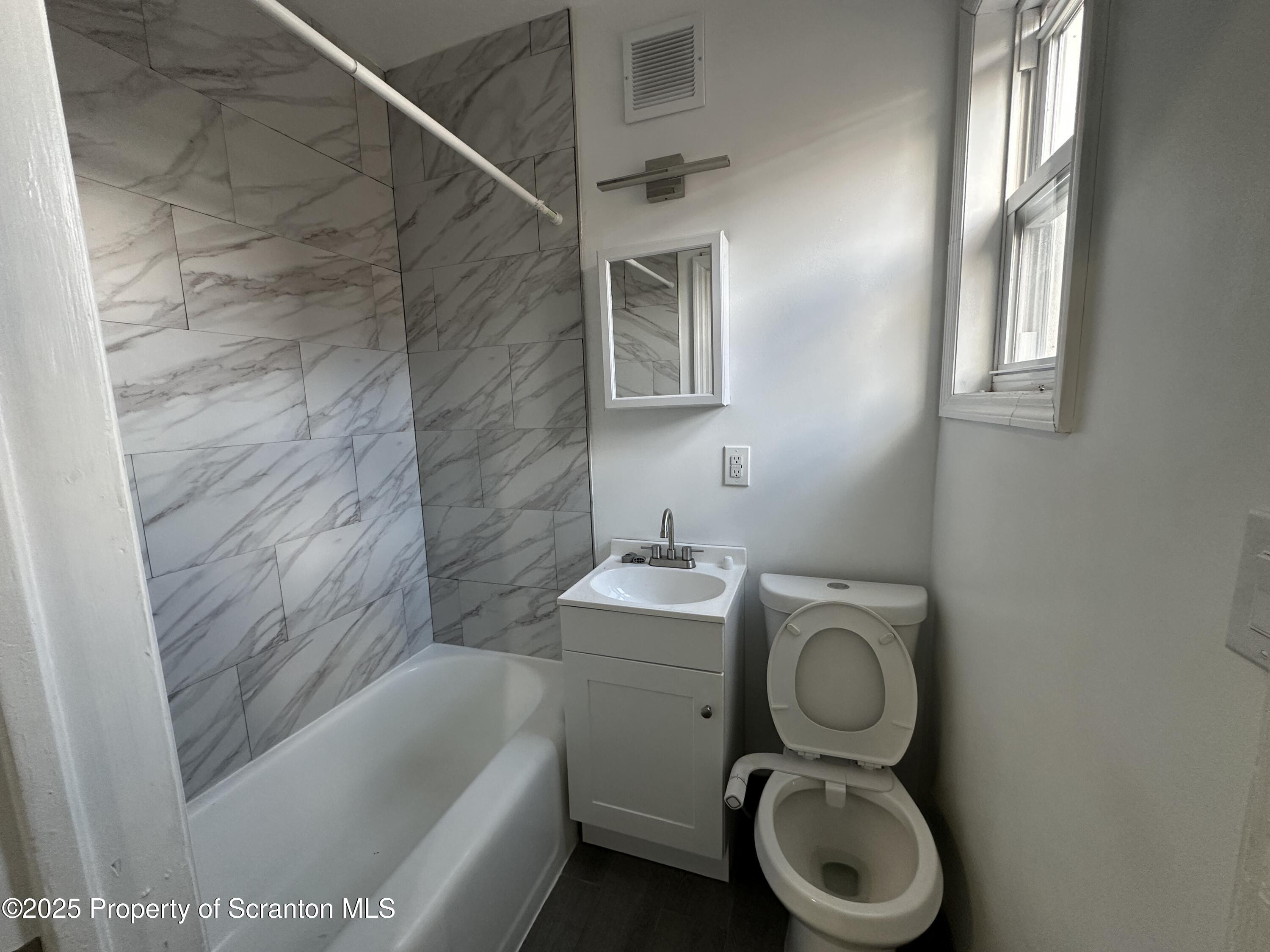 306 Wyoming Avenue, Unit F Wyoming, PA 18644 - Photo 4 of 5 IMG_5212