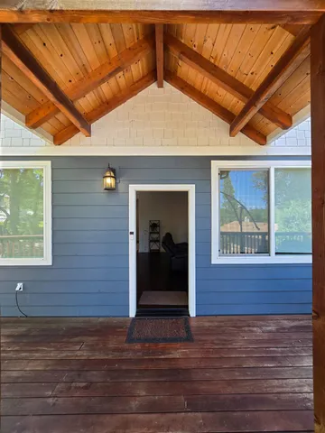 a kitchen with granite countertop a sink stove and refrigerator