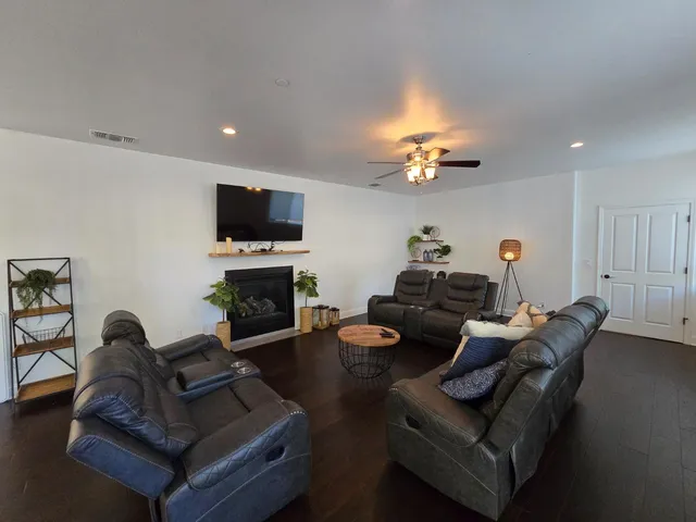 a kitchen with stainless steel appliances granite countertop a sink a stove and a refrigerator