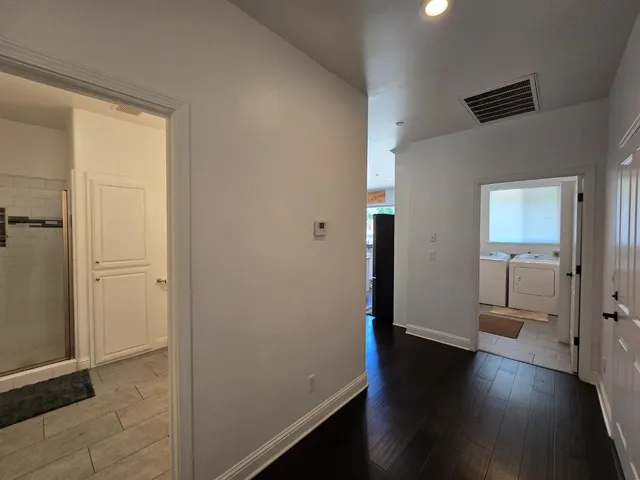 an aerial view of a house with a yard and trees