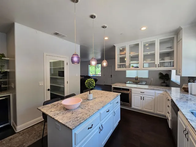 an aerial view of a house with outdoor space