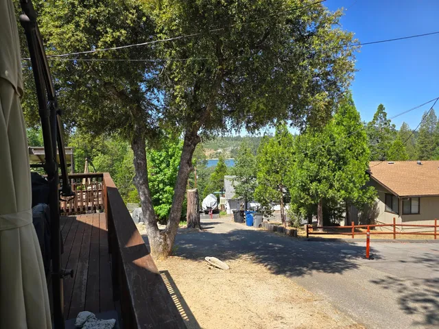 a living room with furniture a flat screen tv and couches
