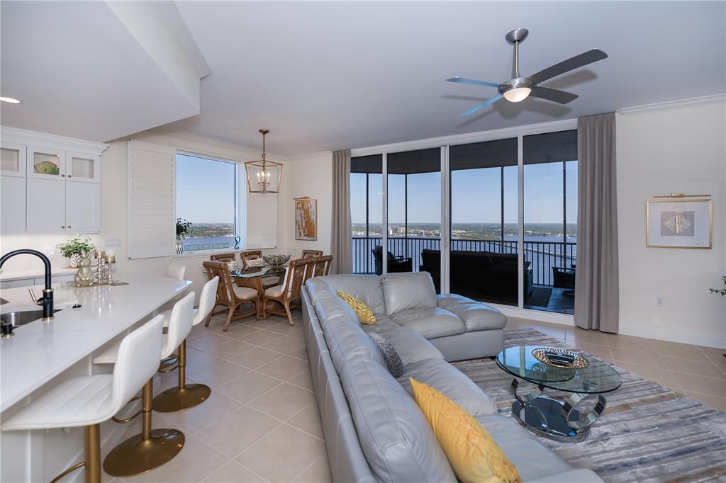 2104 West First Street, Unit 3103 Fort Myers, FL 33901 - Photo 11 of 74 a living room with furniture kitchen view and a window