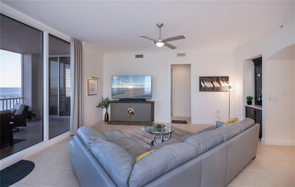 2104 West First Street, Unit 3103 Fort Myers, FL 33901 - Photo 12 of 74 a living room with furniture and a flat screen tv