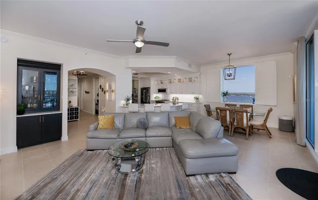 a kitchen with stainless steel appliances white cabinets and a refrigerator
