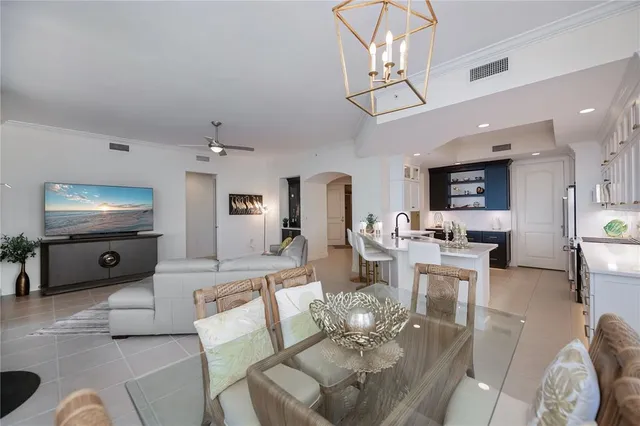 a kitchen with stainless steel appliances a sink stove and refrigerator