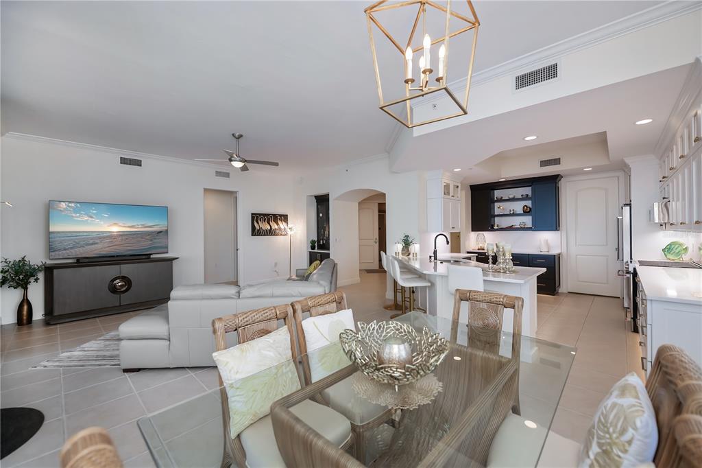2104 West First Street, Unit 3103 Fort Myers, FL 33901 - Photo 15 of 74 a living room with furniture and a flat screen tv