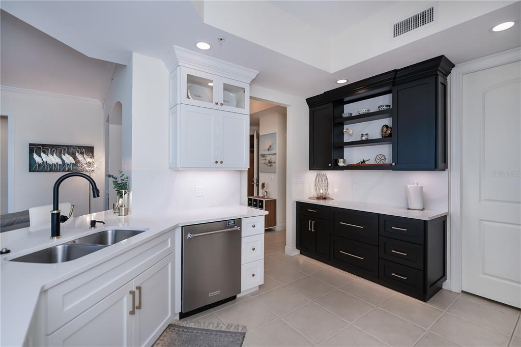 2104 West First Street, Unit 3103 Fort Myers, FL 33901 - Photo 22 of 74 a kitchen with stainless steel appliances granite countertop white cabinets and sink