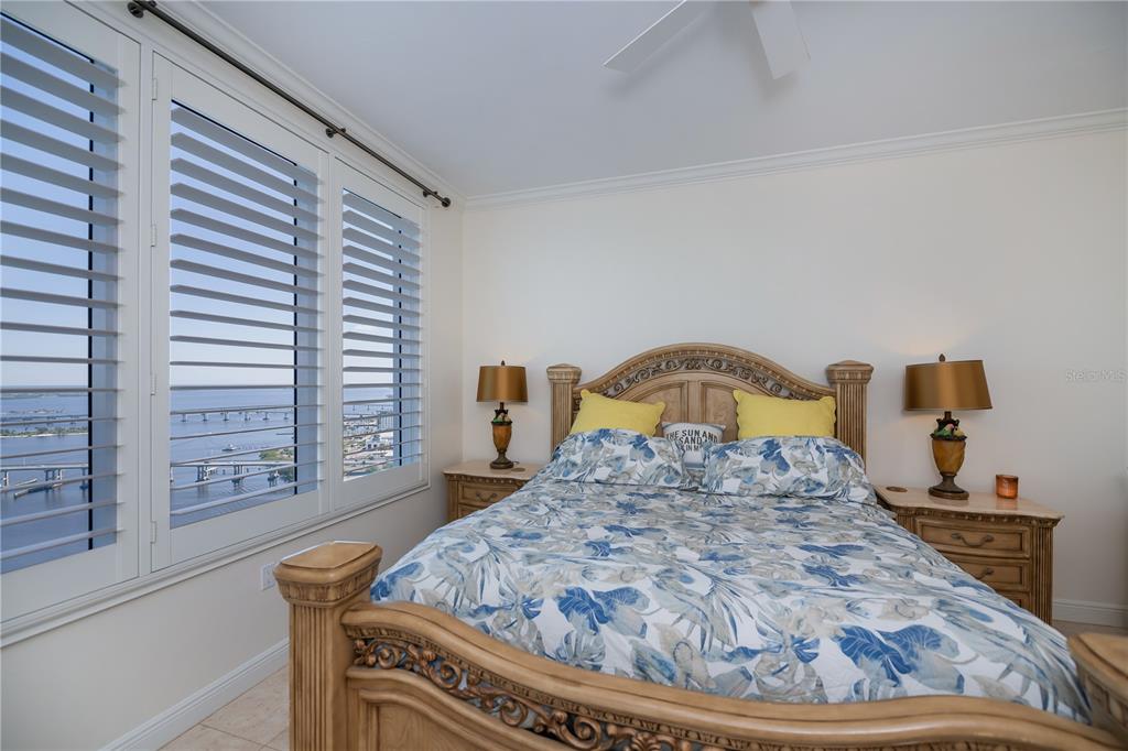 2104 West First Street, Unit 3103 Fort Myers, FL 33901 - Photo 30 of 74 a bed sitting in a bedroom next to a window