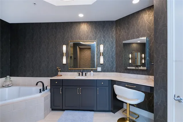 a bedroom with furniture and a flat screen tv