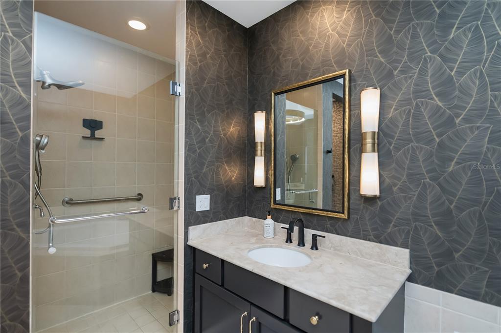 2104 West First Street, Unit 3103 Fort Myers, FL 33901 - Photo 37 of 74 a bathroom with a sink a toilet and shower