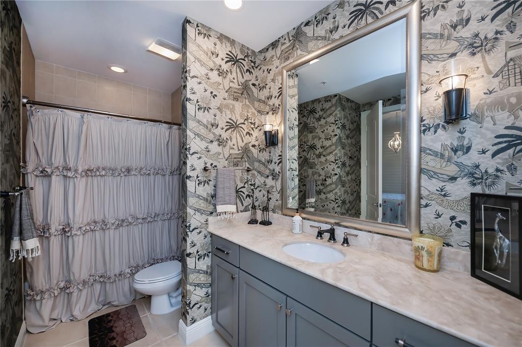 2104 West First Street, Unit 3103 Fort Myers, FL 33901 - Photo 43 of 74 a bathroom with a granite countertop sink toilet and shower
