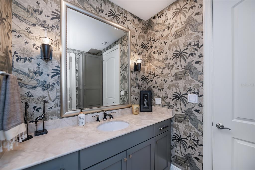 2104 West First Street, Unit 3103 Fort Myers, FL 33901 - Photo 44 of 74 a bathroom with a sink and a mirror