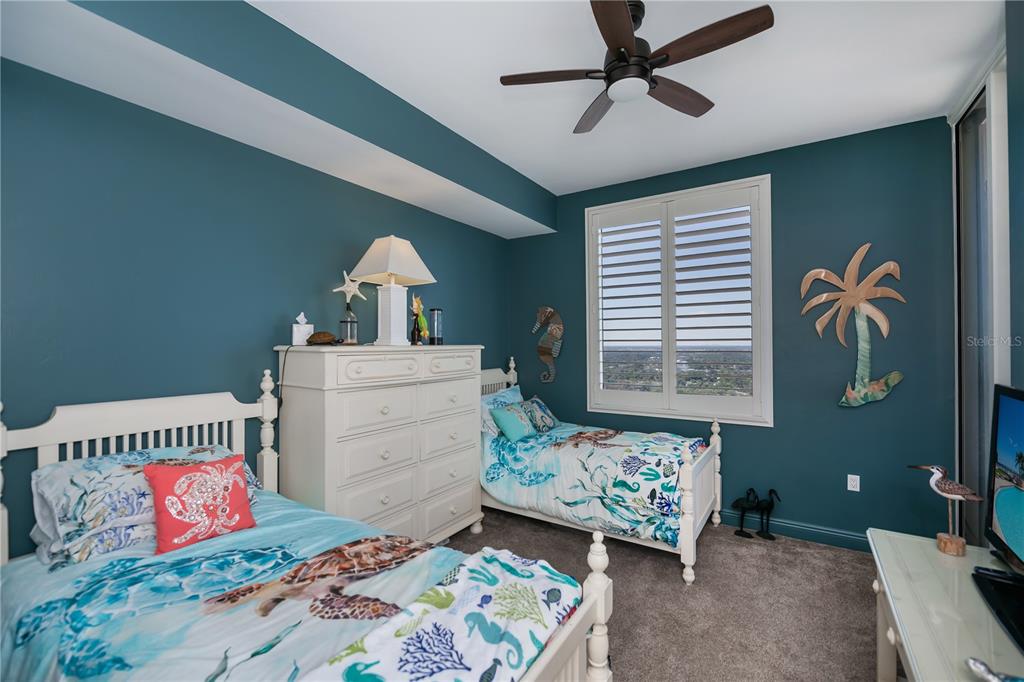 2104 West First Street, Unit 3103 Fort Myers, FL 33901 - Photo 46 of 74 a bedroom with a bed and a dresser