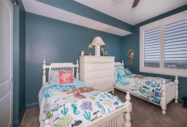a view of hall way with furniture and chandelier