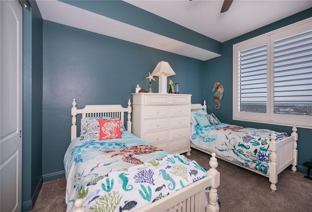 2104 West First Street, Unit 3103 Fort Myers, FL 33901 - Photo 48 of 74 a bedroom with a bed and window