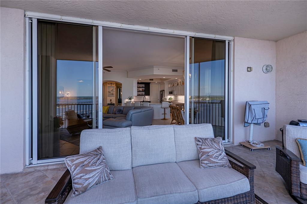 2104 West First Street, Unit 3103 Fort Myers, FL 33901 - Photo 50 of 74 a living room with furniture and a fireplace