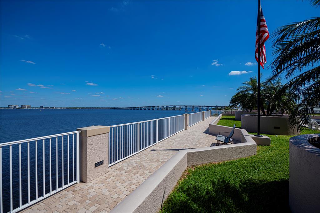 2104 West First Street, Unit 3103 Fort Myers, FL 33901 - Photo 57 of 74 a view of a terrace with couches and wooden fence
