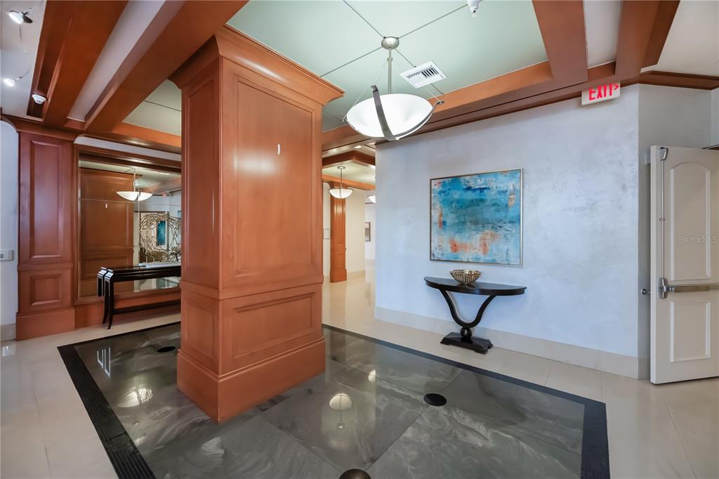 2104 West First Street, Unit 3103 Fort Myers, FL 33901 - Photo 71 of 74 a view of hall way with furniture and chandelier