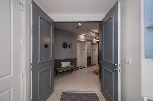 a dining room with furniture potted plants and wooden floor
