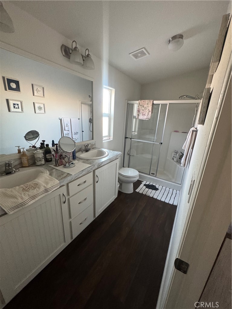 10550 Dunlap Crossing Road Whittier, CA 90606 - Photo 12 of 12 a bathroom with a double vanity sink and mirror