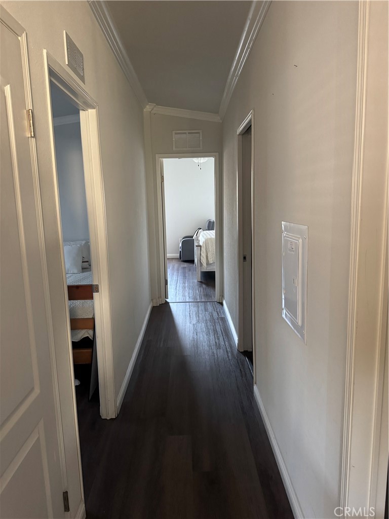 10550 Dunlap Crossing Road Whittier, CA 90606 - Photo 8 of 12 a view of a hallway with wooden floor and a living room