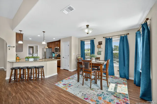 a view of a dining room with furniture