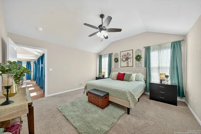 a bathroom with a granite countertop sink a toilet and a mirror