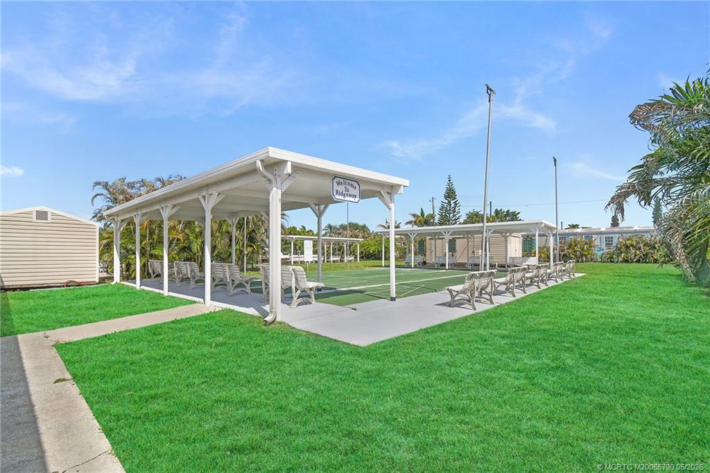 7149 Southeast Ridgeway Terrace Hobe Sound, FL 33455 - Photo 34 of 34 Voluntary membership available for clubhouse with pool and shufflebaord