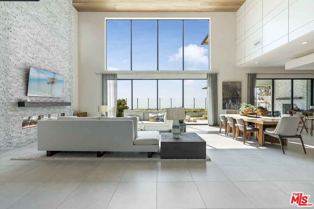 20378 Marlow Lane Porter Ranch, CA 91326 - Photo 11 of 52 a living room with couches and furniture with large window