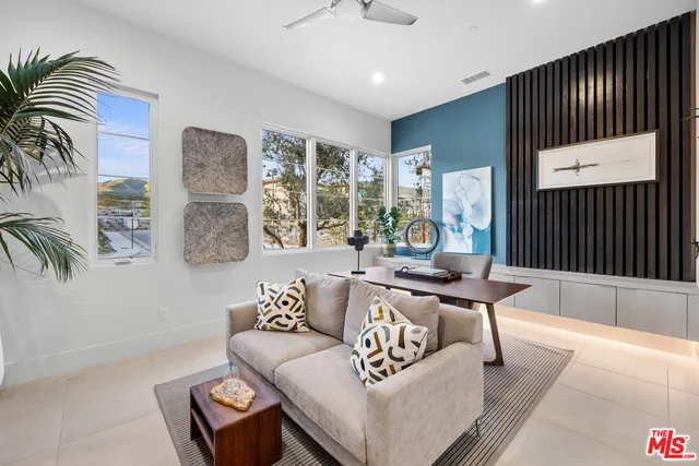 a view of walk in closet and bedroom