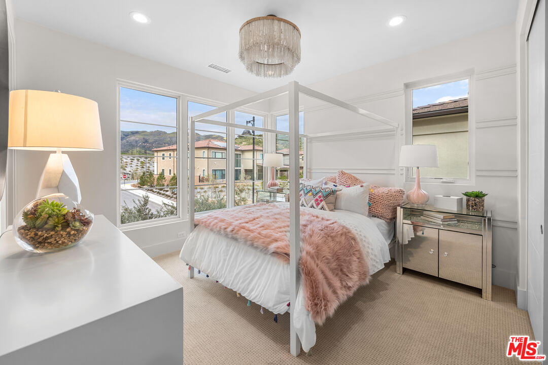 20378 Marlow Lane Porter Ranch, CA 91326 - Photo 28 of 52 a bed room with a bed and a table