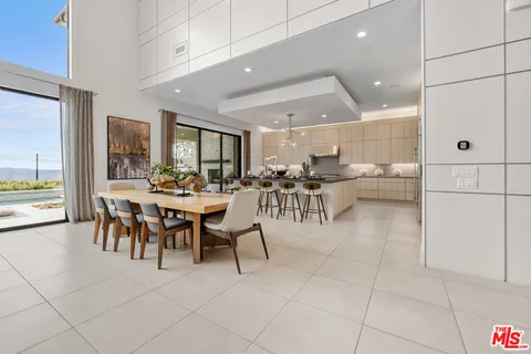 a kitchen with stainless steel appliances kitchen island granite countertop a sink and cabinets