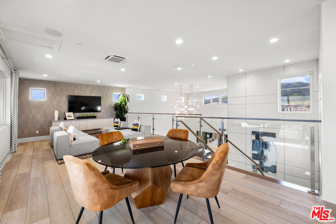 20378 Marlow Lane Porter Ranch, CA 91326 - Photo 34 of 52 a living room with furniture and a flat screen tv