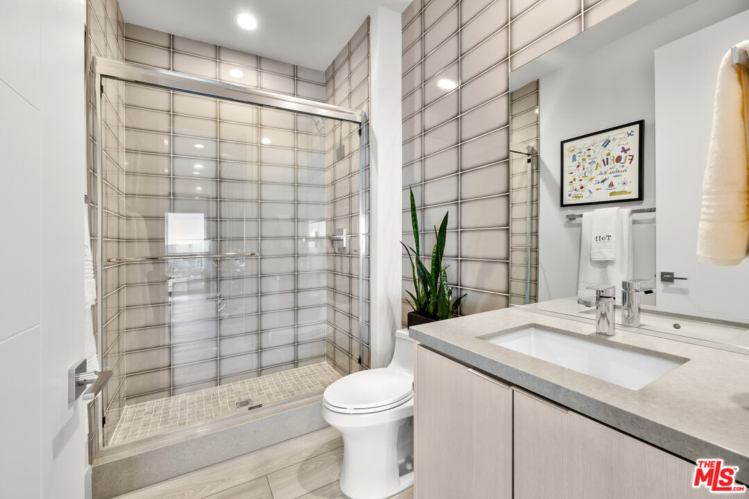 20378 Marlow Lane Porter Ranch, CA 91326 - Photo 36 of 52 a bathroom with a sink toilet and shower