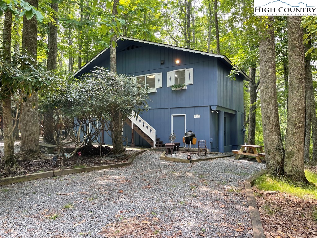 911 Pine Ridge Road Beech Mountain, NC 28604 - Photo 15 of 22 a view of a house with a yard