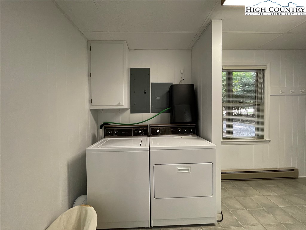 911 Pine Ridge Road Beech Mountain, NC 28604 - Photo 20 of 22 a utility room with dryer and washer
