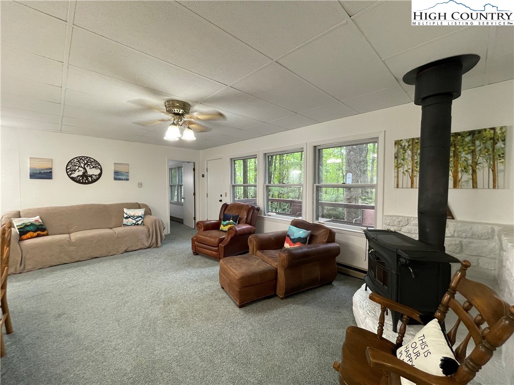 911 Pine Ridge Road Beech Mountain, NC 28604 - Photo 4 of 22 a living room with furniture and a large window