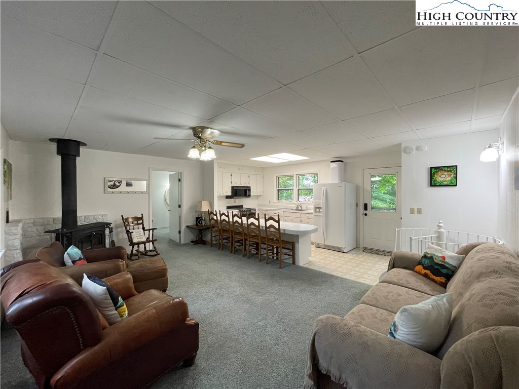 911 Pine Ridge Road Beech Mountain, NC 28604 - Photo 5 of 22 a living room with furniture and a couch